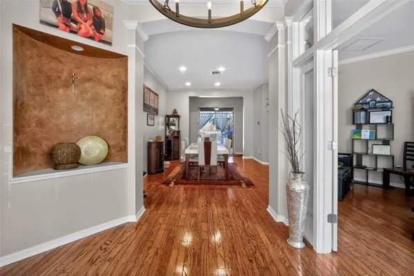 a view of a living room and a wooden floor