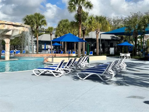 a view of a table and chairs under an umbrella