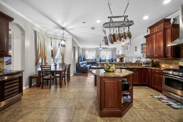a kitchen with lots of appliances and furniture
