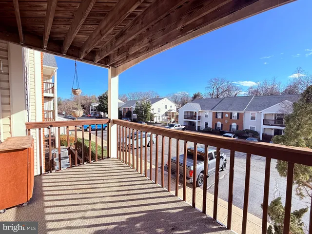 a view of a balcony with furniture
