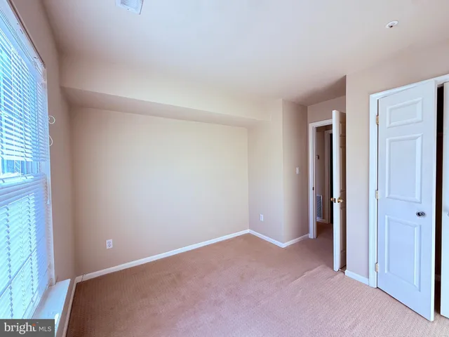 a room with a bed and a window