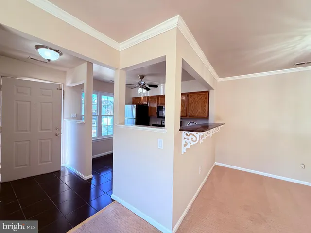a view of living room with furniture and wooden floor