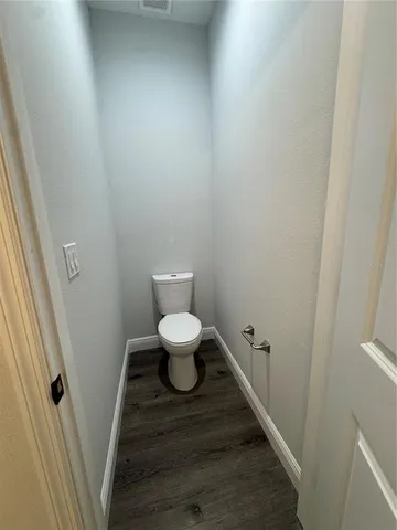 a bathroom with a toilet and a sink