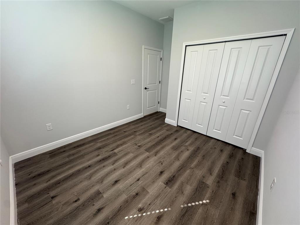 7105 Princeton Street Port Charlotte, FL 33981 - Photo 21 of 26 a view of a room with wooden floor