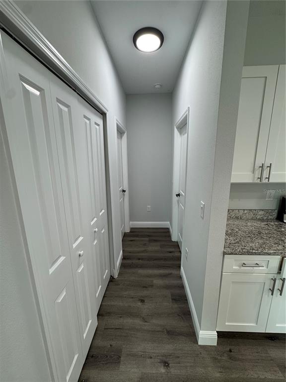 7105 Princeton Street Port Charlotte, FL 33981 - Photo 7 of 26 a view of a hallway with wooden floor and staircase