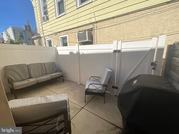 a view of two chairs in the balcony