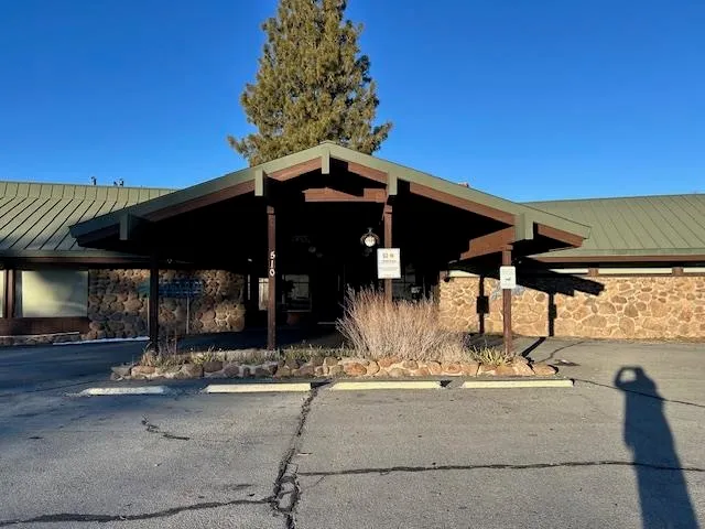 a view of a chairs and table in patio