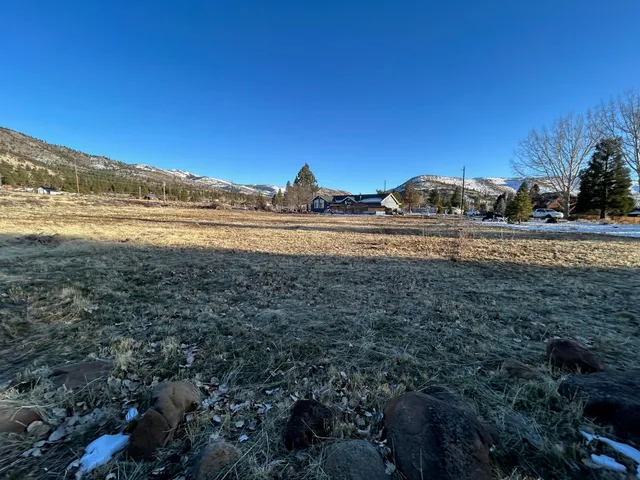 a view of an ocean and a mountain