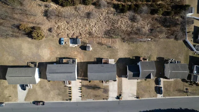 an aerial view of a city with lots of residential buildings