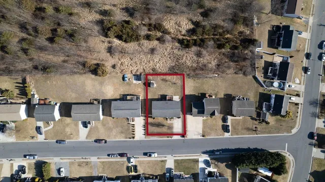 a view of a house with a yard and mountain view