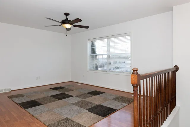 a view of a livingroom with a flesh screen on the ceiling window