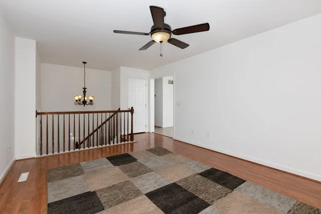 a view of room with a ceiling fan