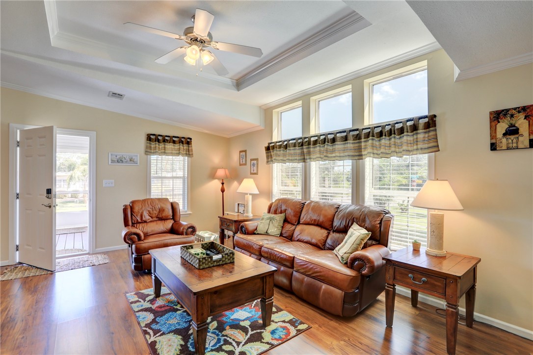 309 Pineapple Street Sebastian, FL 32958 - Photo 11 of 36 a living room with furniture a table and a window