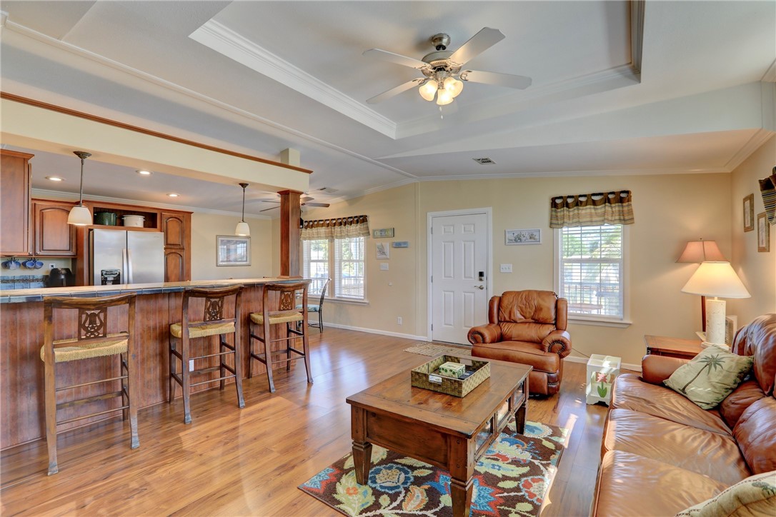 309 Pineapple Street Sebastian, FL 32958 - Photo 12 of 36 a living room with furniture a dining table and wooden floor