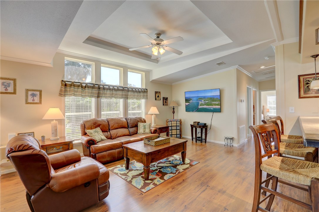 309 Pineapple Street Sebastian, FL 32958 - Photo 14 of 36 a living room with furniture a table and a large window