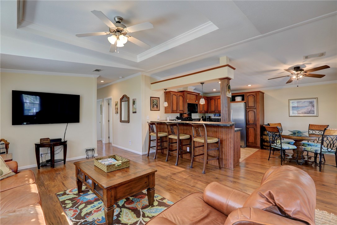 309 Pineapple Street Sebastian, FL 32958 - Photo 15 of 36 a living room with furniture and a flat screen tv