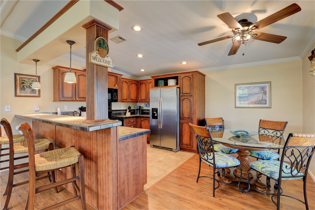 309 Pineapple Street Sebastian, FL 32958 - Photo 21 of 36 a living room with stainless steel appliances kitchen island granite countertop furniture and a dining table