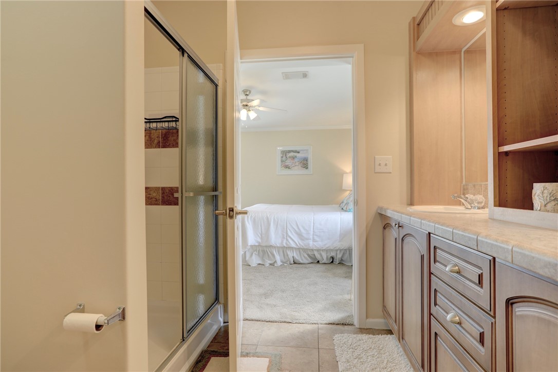 309 Pineapple Street Sebastian, FL 32958 - Photo 30 of 36 a bathroom with a granite countertop sink and a mirror