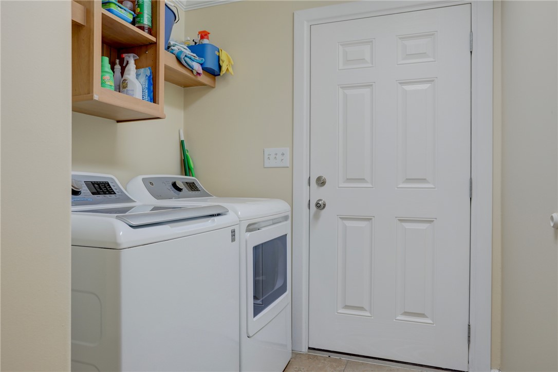 309 Pineapple Street Sebastian, FL 32958 - Photo 36 of 36 a utility room with dryer and washer
