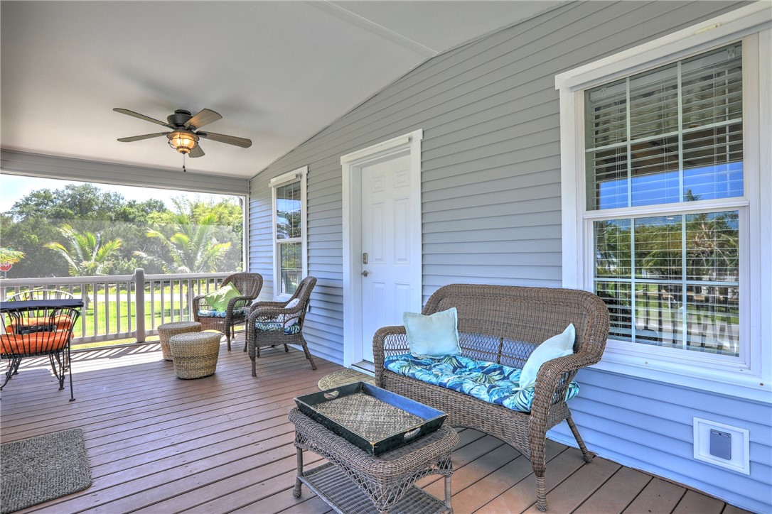 309 Pineapple Street Sebastian, FL 32958 - Photo 7 of 36 a living room with furniture and a floor to ceiling window