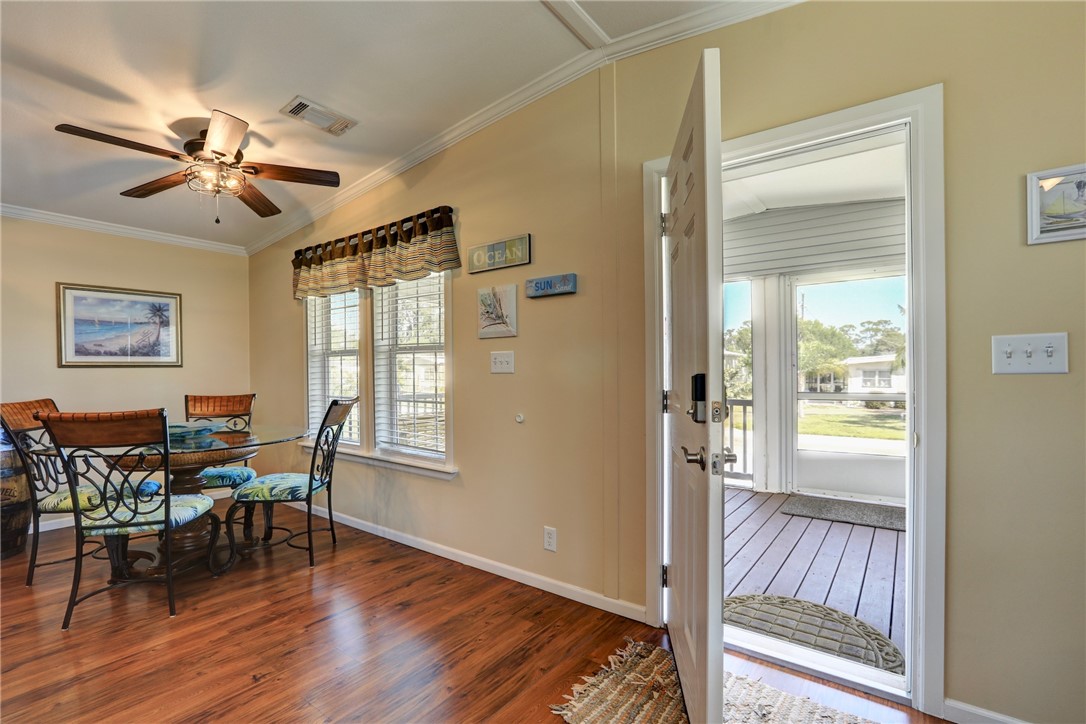 309 Pineapple Street Sebastian, FL 32958 - Photo 10 of 36 a view of a livingroom with furniture and wooden floor