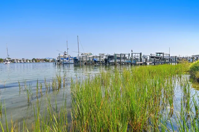 a large body of water with a building in the background