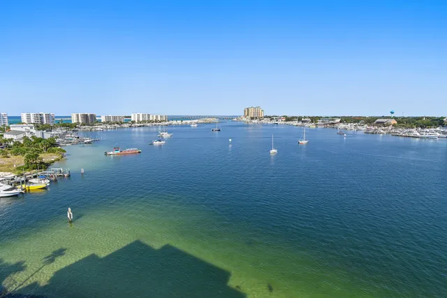 a view of a lake with tall buildings in the background