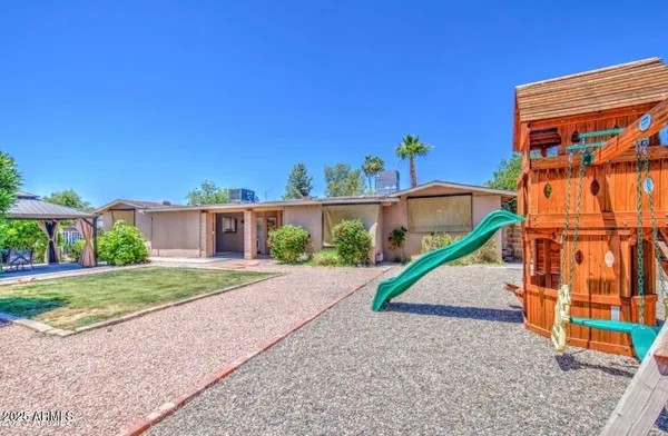 a house view with a backyard space