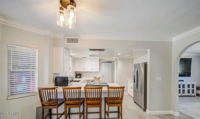 a view of a dining room with furniture