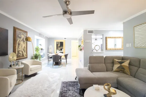 a living room with furniture and a large window