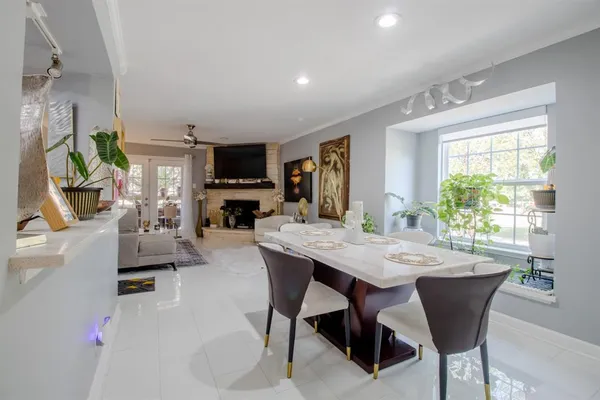a dining room with furniture and window