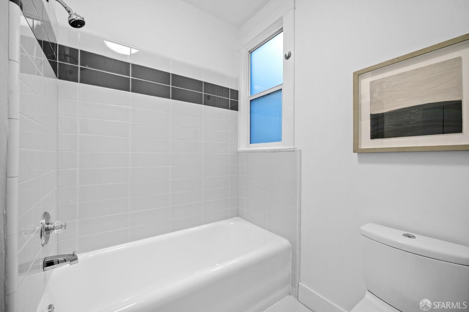 1310 5th Avenue, Unit 1 San Francisco, CA 94122 - Photo 18 of 31 a bathroom with a bathtub and a shower