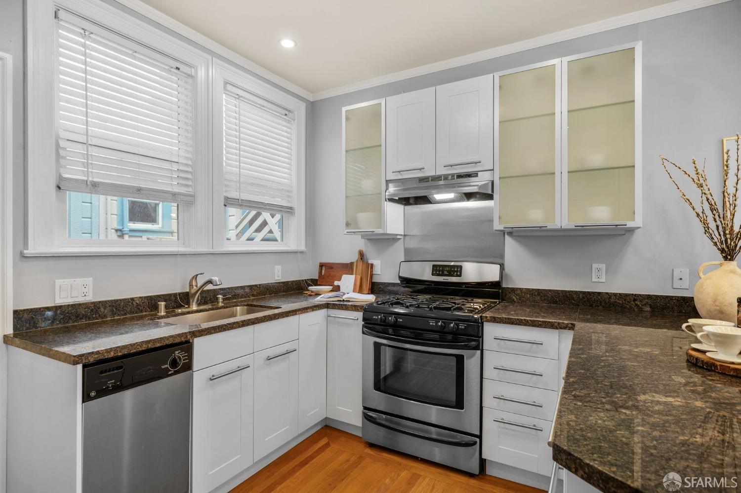 1310 5th Avenue, Unit 1 San Francisco, CA 94122 - Photo 6 of 31 a kitchen with stainless steel appliances granite countertop a sink stove and cabinets