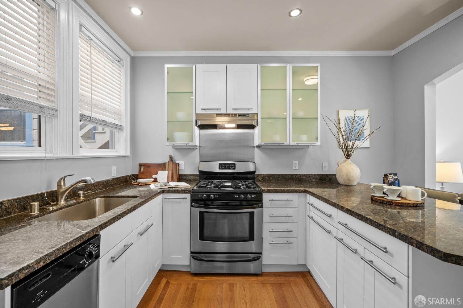 1310 5th Avenue, Unit 1 San Francisco, CA 94122 - Photo 7 of 31 a kitchen with a sink stove top oven and cabinets