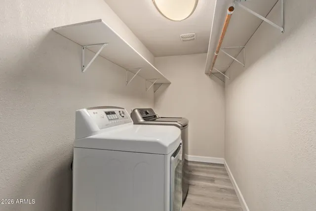a utility room with dryer and washer