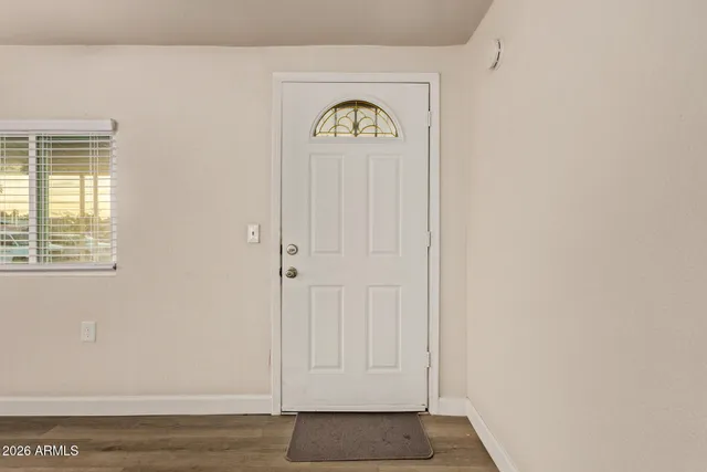 a view of entryway with wooden floor