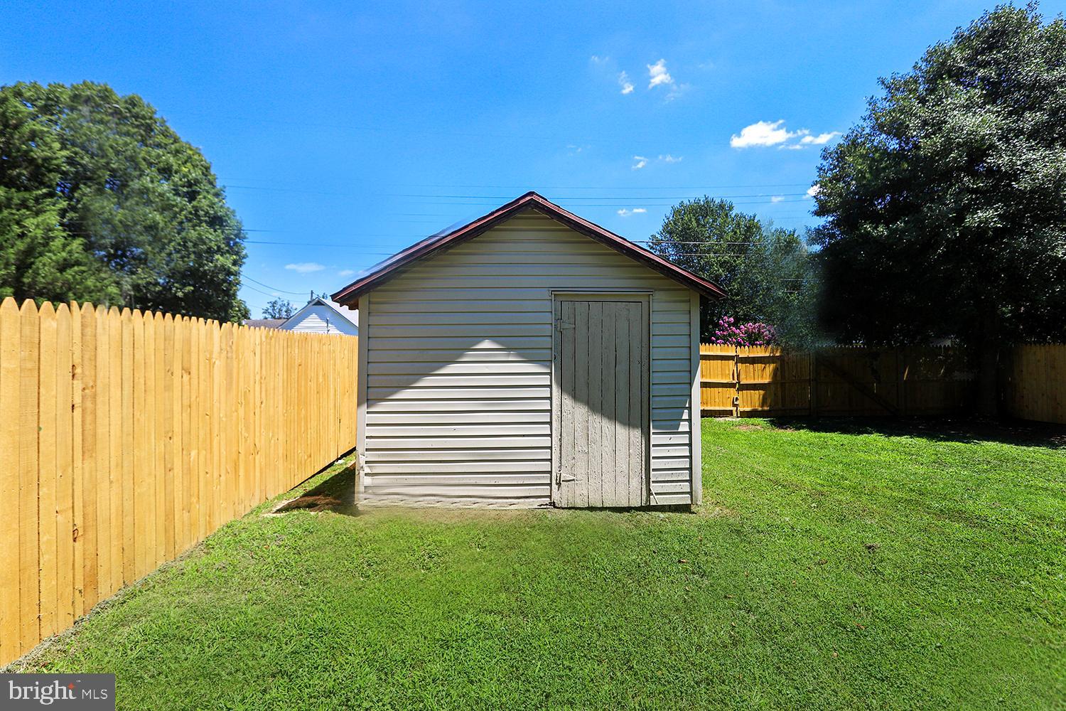 208 Maple Avenue Ridgely, MD 21660 - Photo 18 of 38 Privacy Fenced Yard . Detached Storage Shed