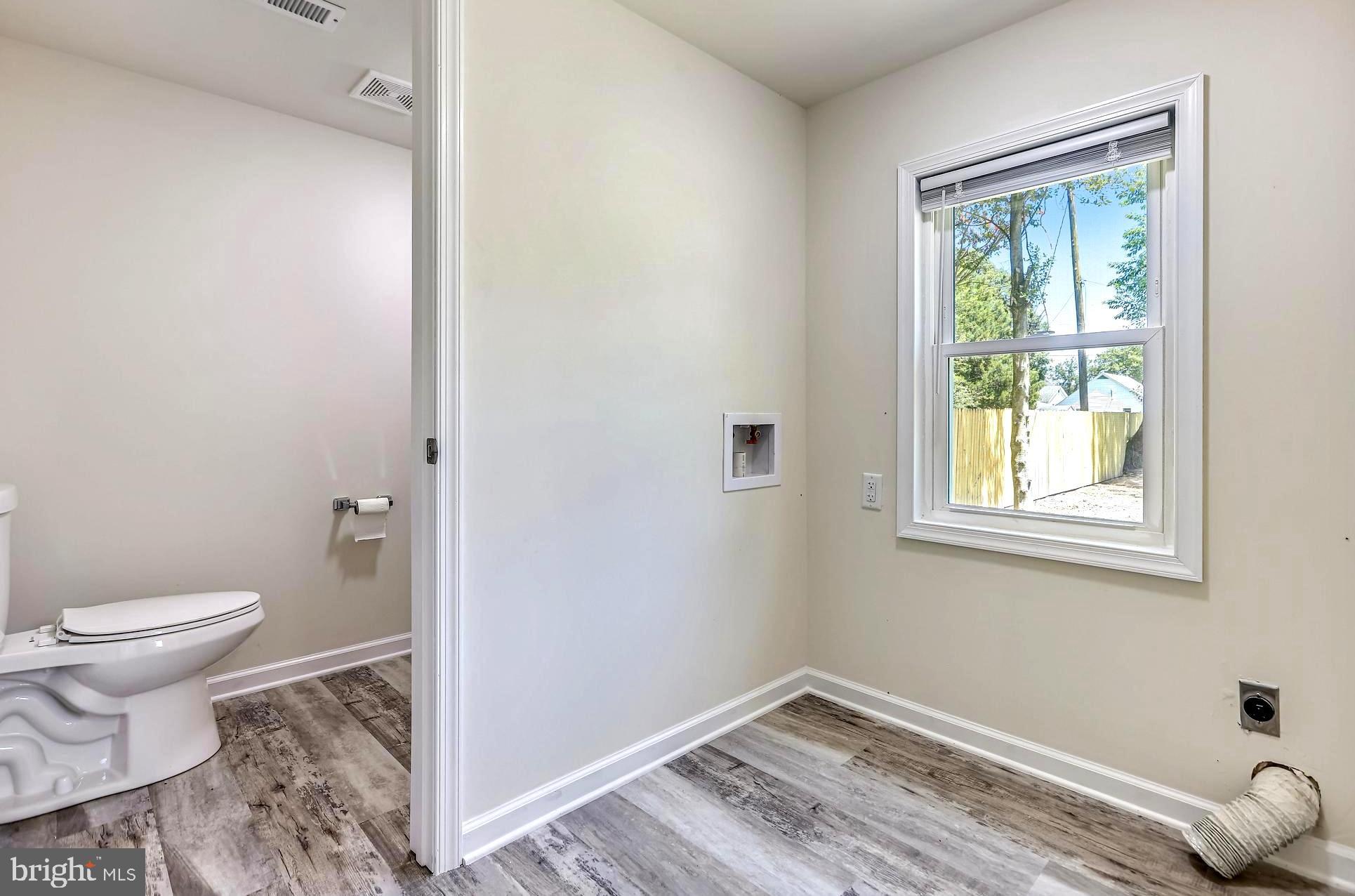 208 Maple Avenue Ridgely, MD 21660 - Photo 19 of 38 Main Level Half/Guest Bath and Laundry Area