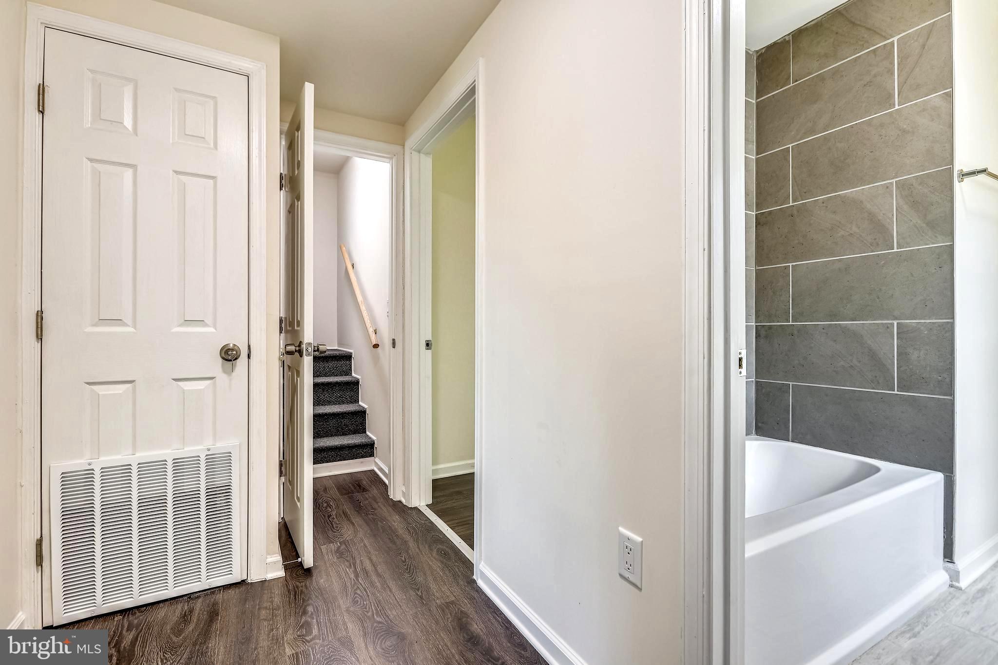 208 Maple Avenue Ridgely, MD 21660 - Photo 25 of 38 Upper Hallway with Staircase to Loft