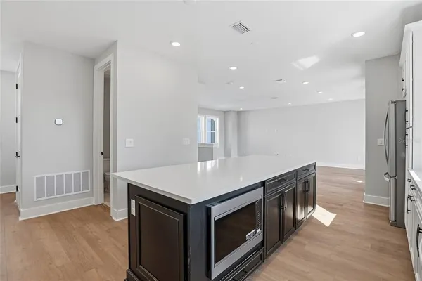 a kitchen with a stove a sink and a refrigerator