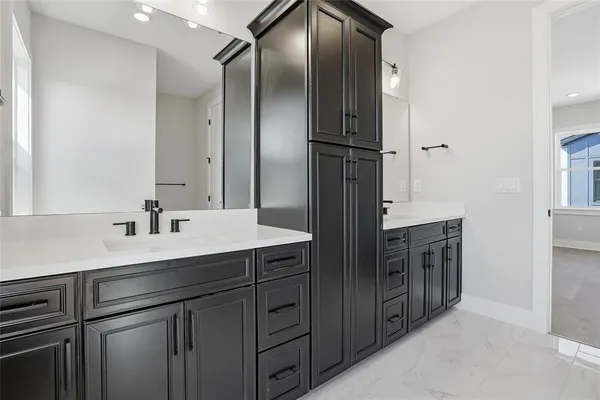 a kitchen with cabinets and stainless steel appliances