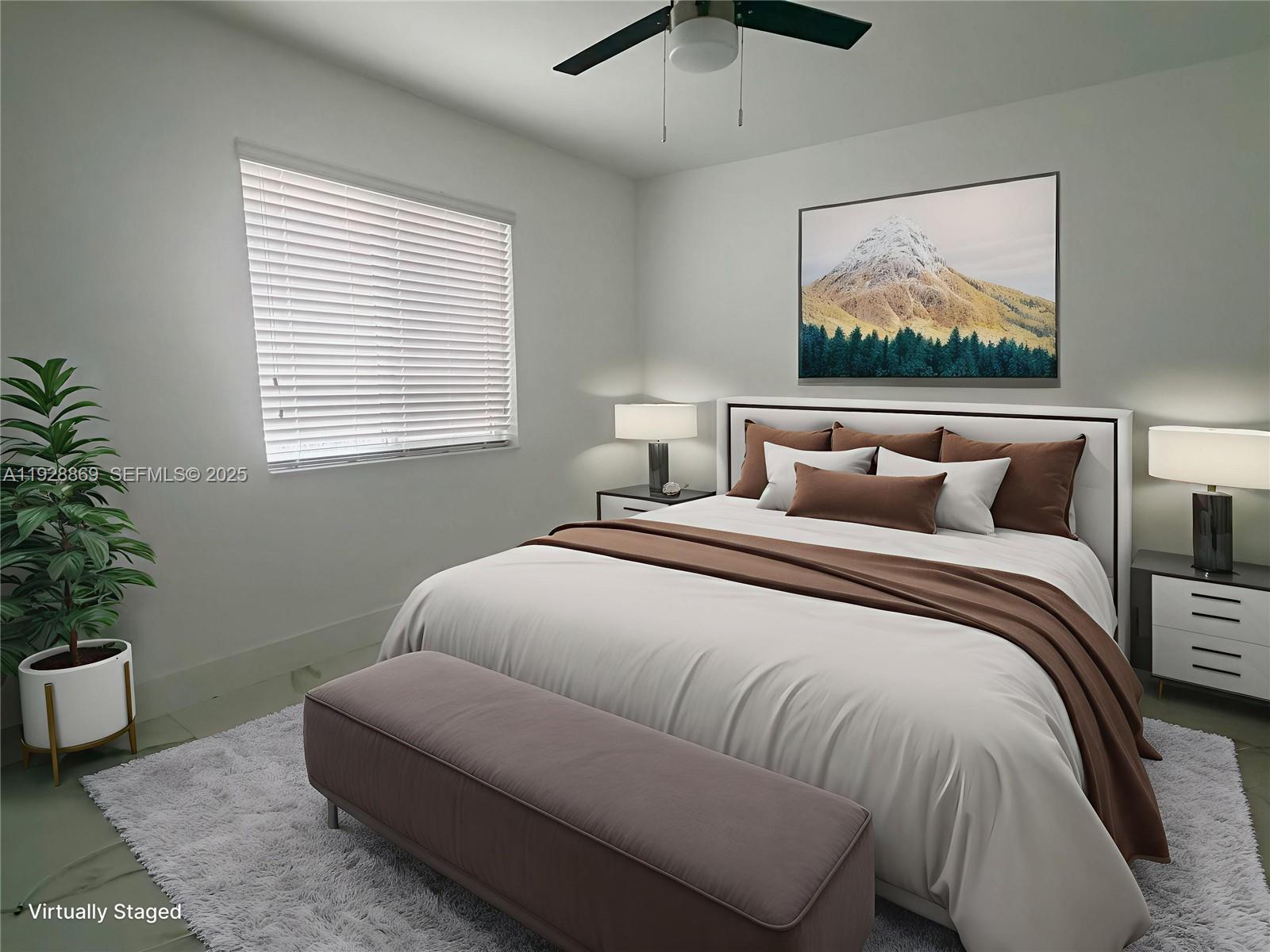 1629 Southwest 3rd Street, Unit 5 Miami, FL 33135 - Photo 15 of 24 a bedroom with a large bed and a painting on the wall
