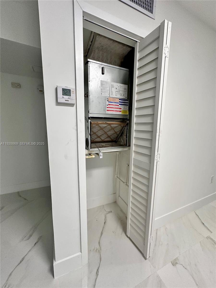 1629 Southwest 3rd Street, Unit 5 Miami, FL 33135 - Photo 23 of 24 a bathroom with a sink and a mirror