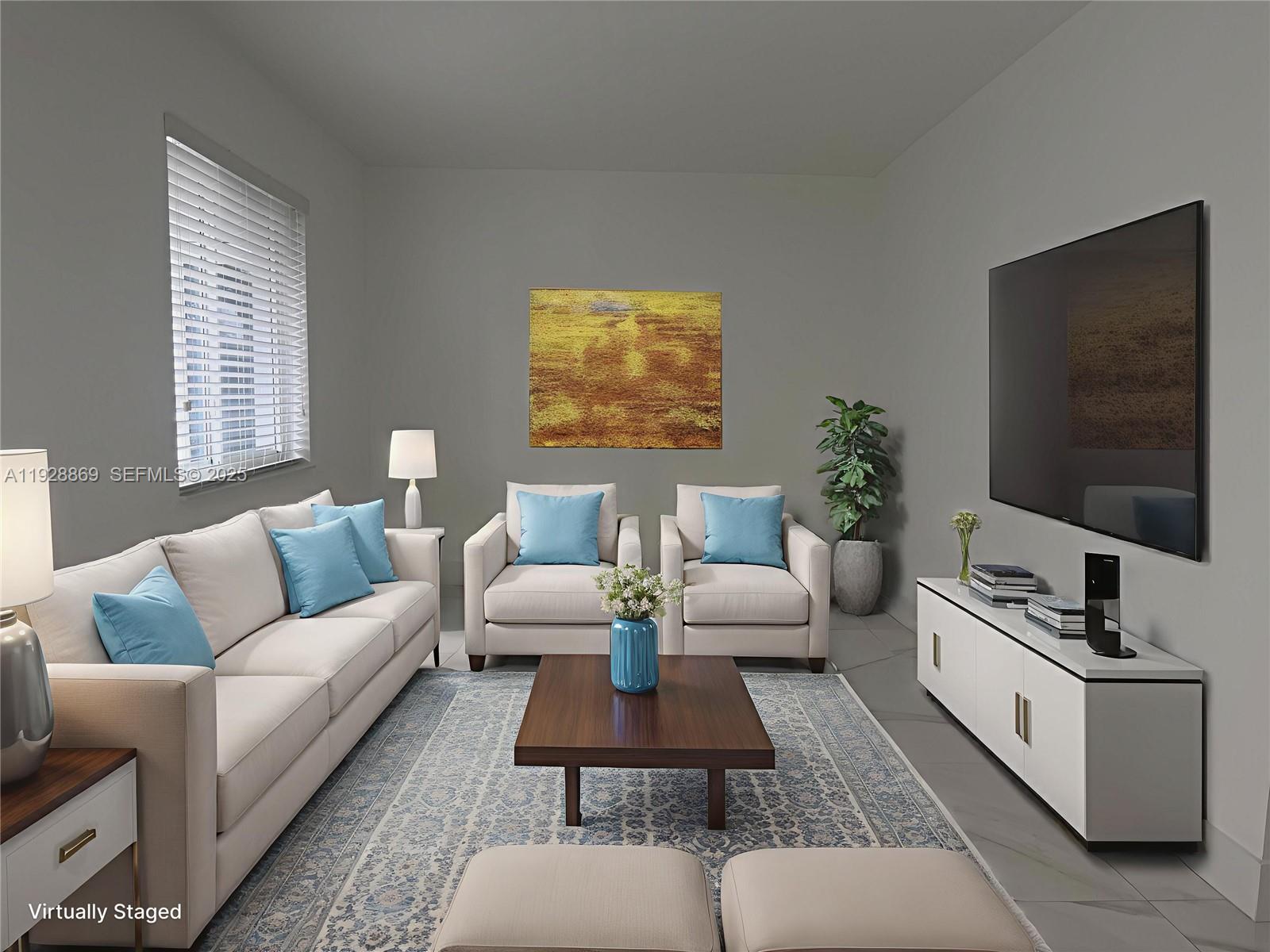 1629 Southwest 3rd Street, Unit 5 Miami, FL 33135 - Photo 7 of 24 a living room with furniture and a flat screen tv