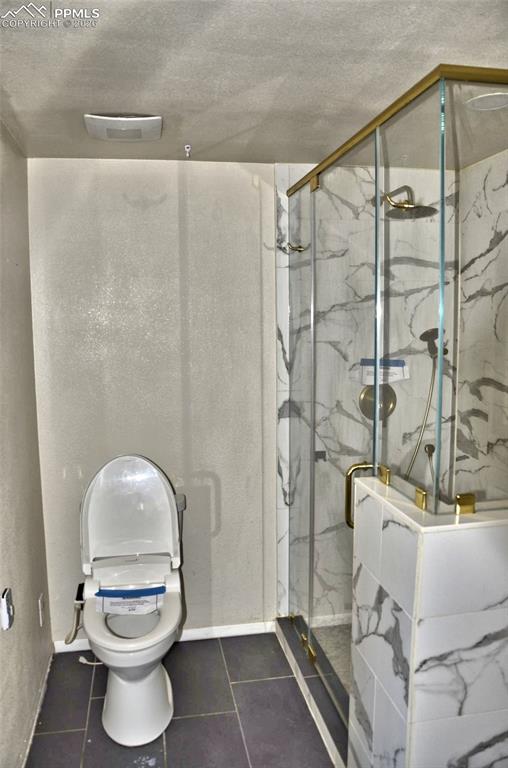 4506 Ranch Circle Colorado Springs, CO 80918 - Photo 7 of 15 a bathroom with a toilet and a shower