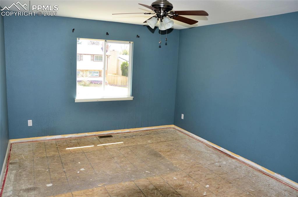 4506 Ranch Circle Colorado Springs, CO 80918 - Photo 8 of 15 an empty room with a window