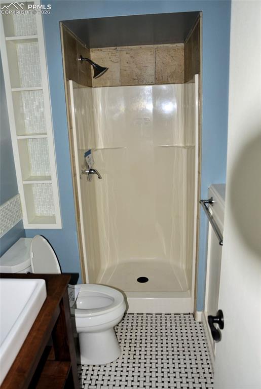 4506 Ranch Circle Colorado Springs, CO 80918 - Photo 10 of 15 a bathroom with a glass door shower