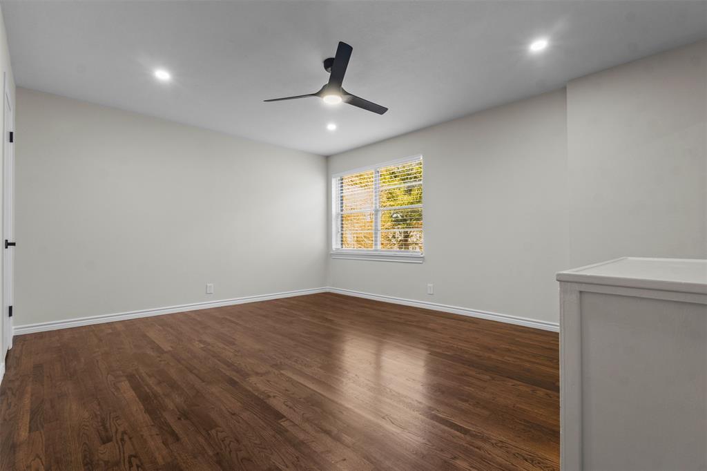 4941 North Hall Street Dallas, TX 75235 - Photo 12 of 18 Unfurnished room with dark wood-style flooring, recessed lighting, and a ceiling fan