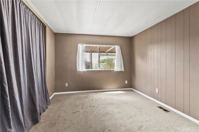 a view of utility room and bedroom