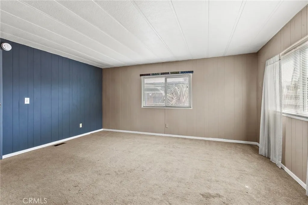 519 West Taylor Street, Unit 252 Santa Maria, CA 93458 - Photo 13 of 52 an empty room with windows